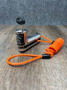 Genuine Harley-Davidson Chrome Disc Brake Rotor Lock with orange reminder cord